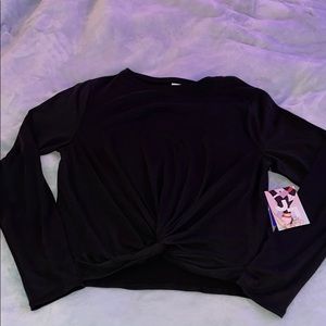 Black long sleeve athletic top with twist.